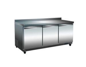 A stainless steel counter with three doors.